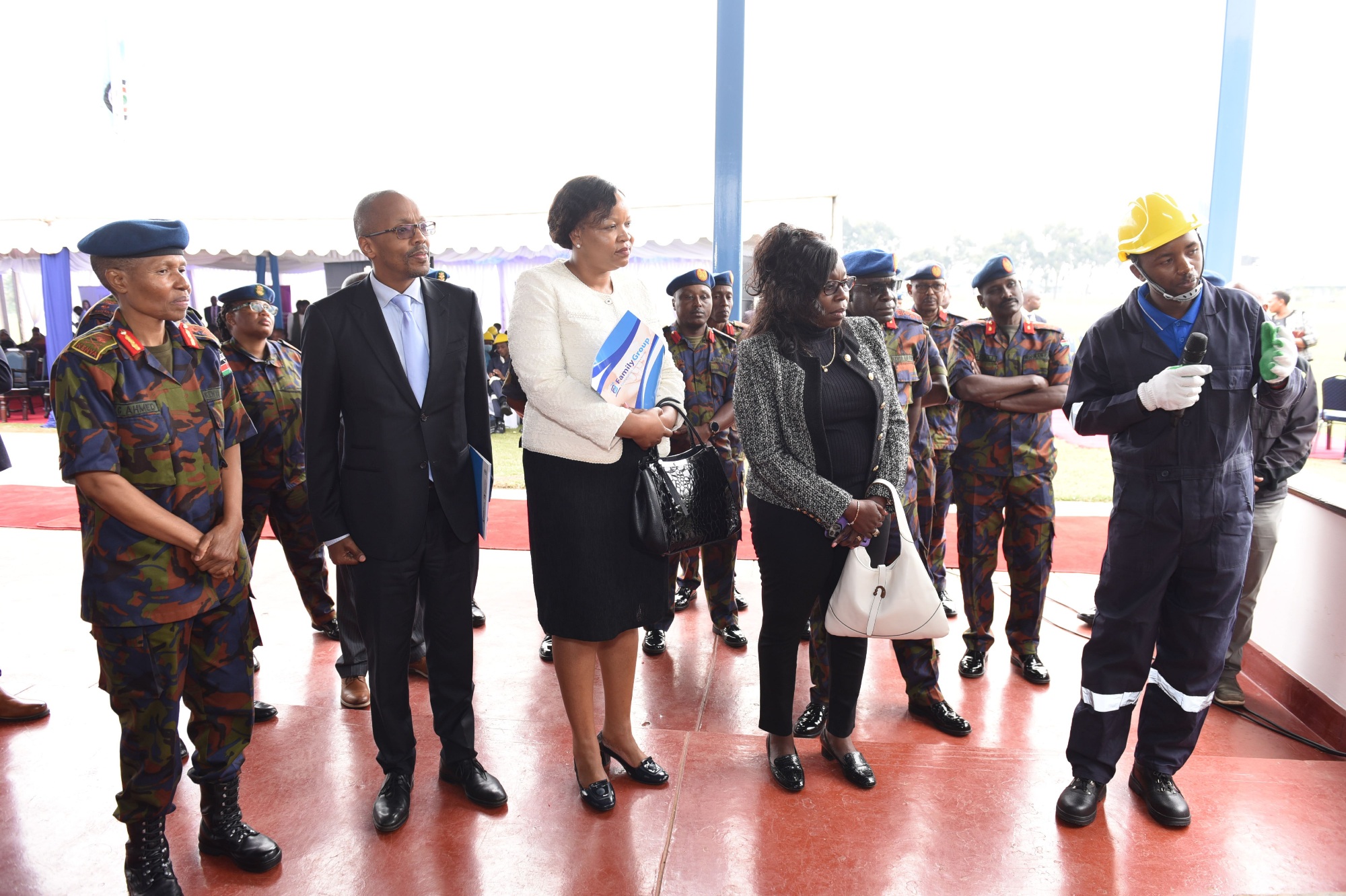 Innocent Ndambuki demonstrates his electrical skills to Kenya Air Force Commander Major General Fatuma Ahmed, Family Bank Non-Executive Director Mark Keriri, CEO Nancy Njau, Military Wives Association of Kenya (MWAK) Chair Grace Kahariri during the graduation of 50 dependents of Kenya Air Force service men and women from the vocational and technical skills programme by The Family Group Foundation and MWAK. PHOTO/COURTESY