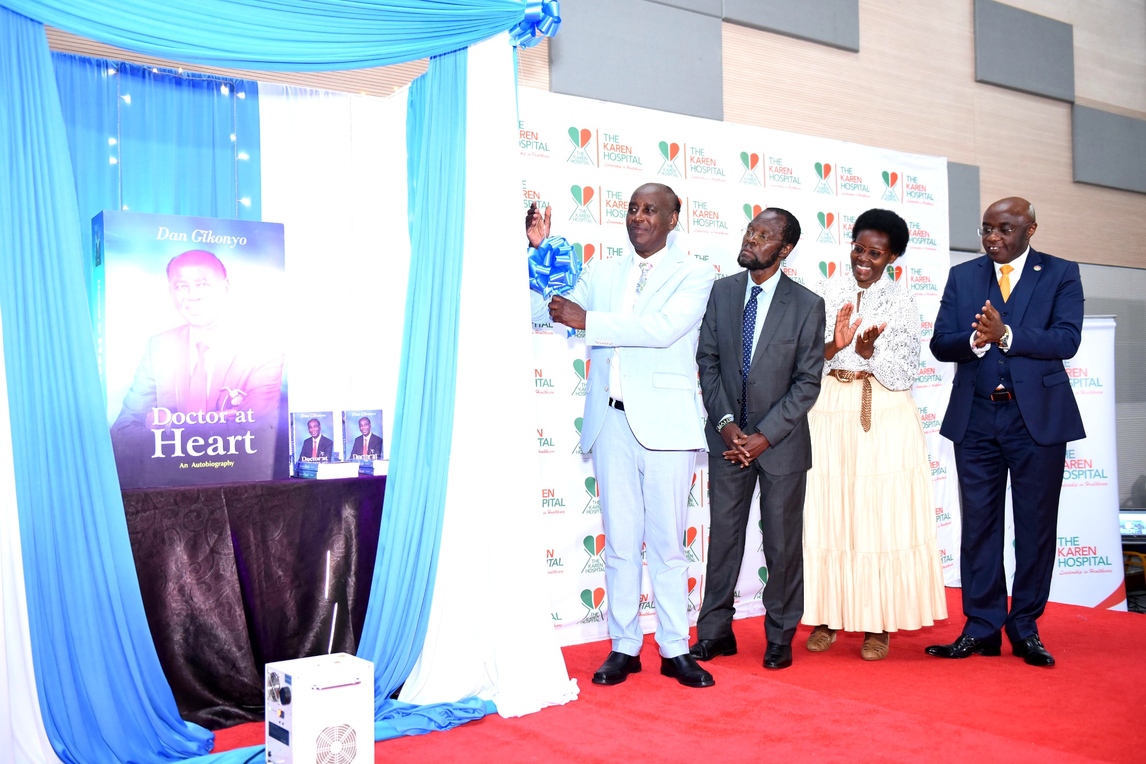 .Kisumu Governor H.E. Prof. Anyang' Nyong'o join East African Educational Publishers CEO Kiarie Kamau (L) & Karen Hospital Chair Dr. Betty Gikonyo during the launch of an autobiography, Doctor at Heart, by renown cardiologist Dr. Dan Gikonyo (2nd L)