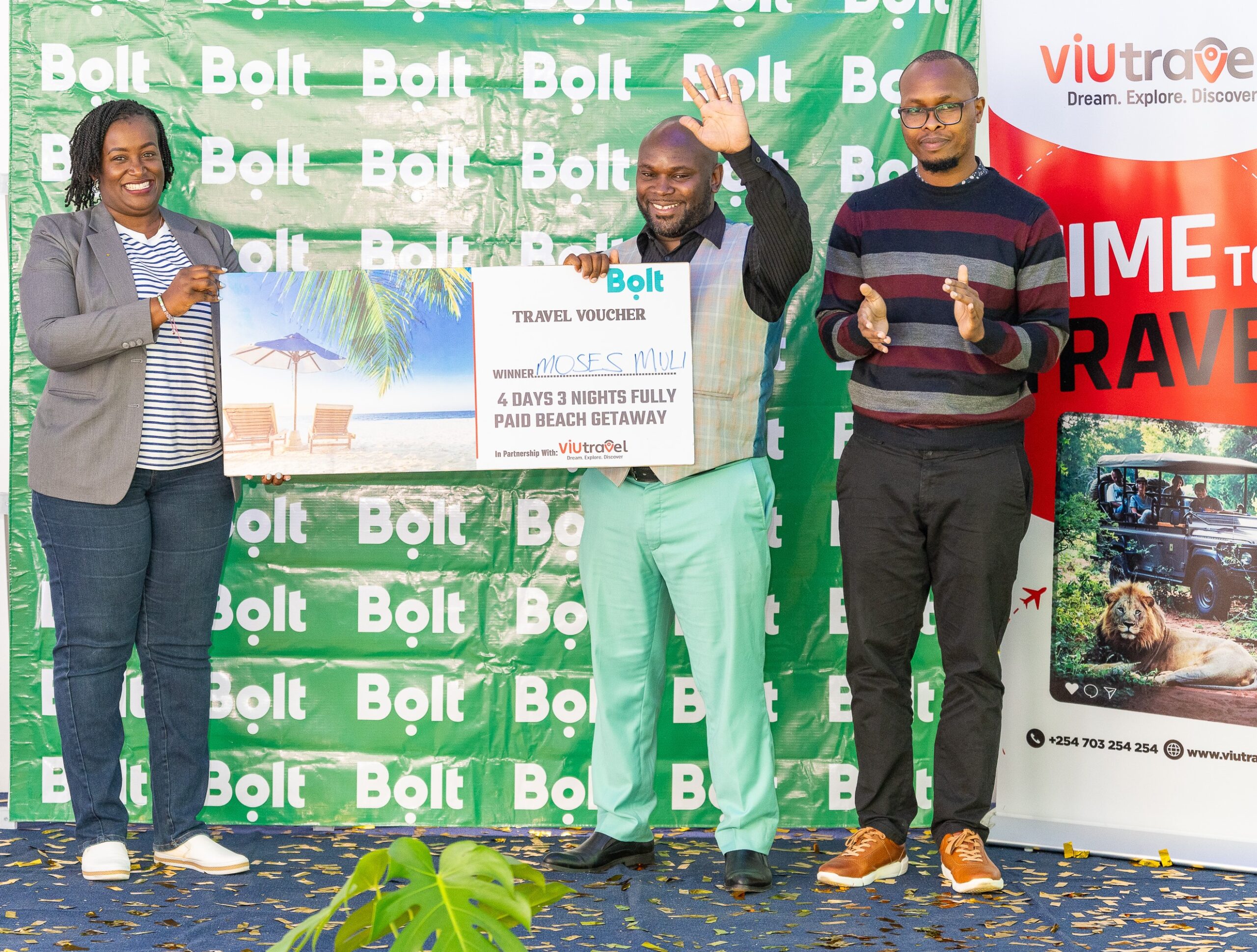 From left to right, Adega Murbe Onyango, Regional Marketing Manager, Bolt with the top prize winner, Moses Muli and Felix Musa, CEO ViuTravel, one of the event's partners.