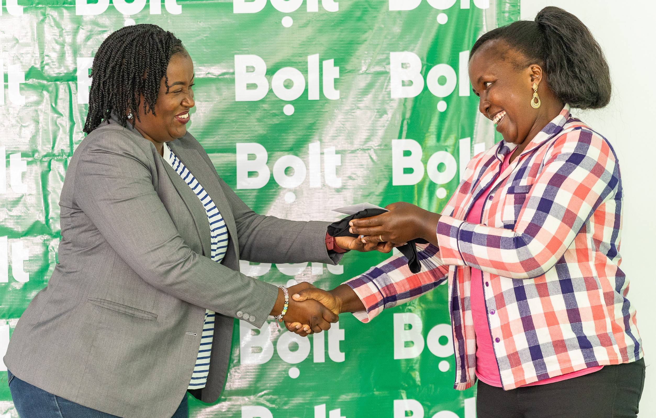 Adega Murbe Onyango, Regional Marketing Manager, Bolt with Esther Nthiani, one of the top women drivers feted at the Drive for a prize event.