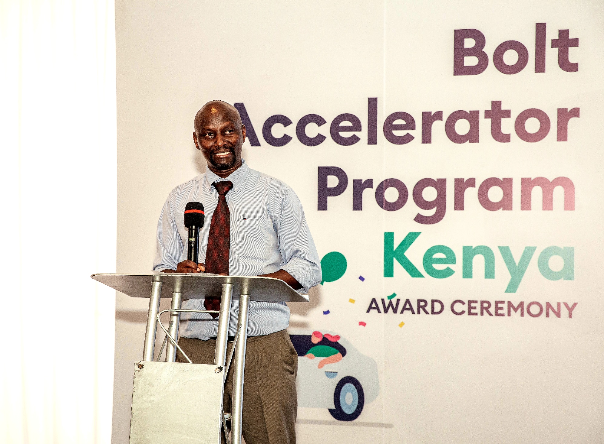 Paul Kingori, Director of Transport and Policy, in charge of Roads and Rails, Ministry of Transport, gives his remarks during the Bolt Accelerator Program awards event.