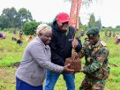 Minet CEO Sammy Muthui (centre) is assisted to plant a tree by Joseph Macharia, Deputy County Forest Conservator, Kenya Forest Services- Kiambu County (Right) and Salome Wairimu a resident of Matathia, Lari. The event saw Minet and the community sow over 20,000 tree seedlings at the Matathia block of the Uplands Forest in Lari Constituency, Kiambu County. The company is targeting to plant 500,000 trees in Kenya by 2030.