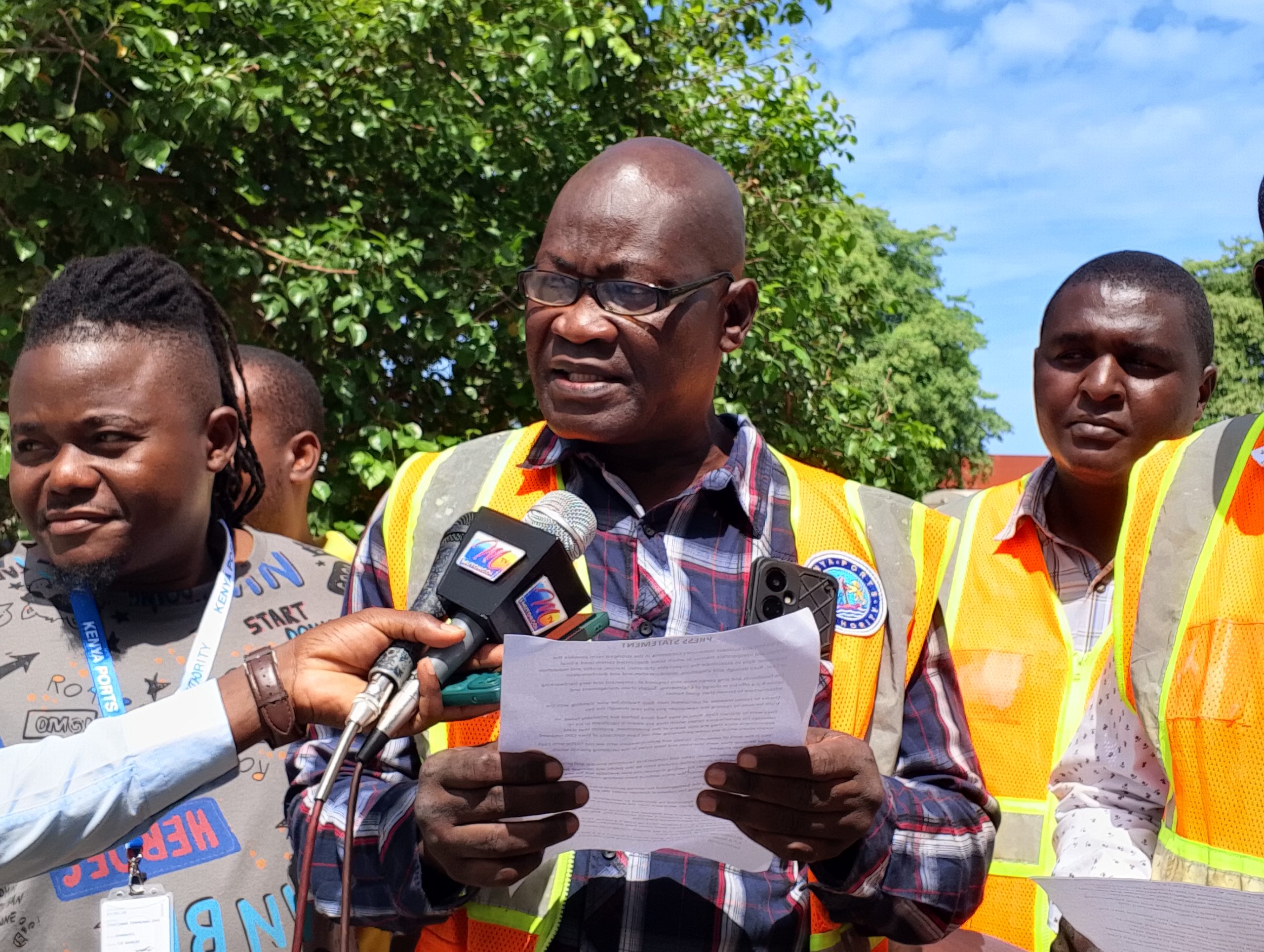 former Dock Workers Union (DWU) official Paul Abisa and Wycliffe Baraza who were reacting to a story on a KPA tender scandal which appeared in local paper during a media briefing held along the port's main gate in Mombasa county.