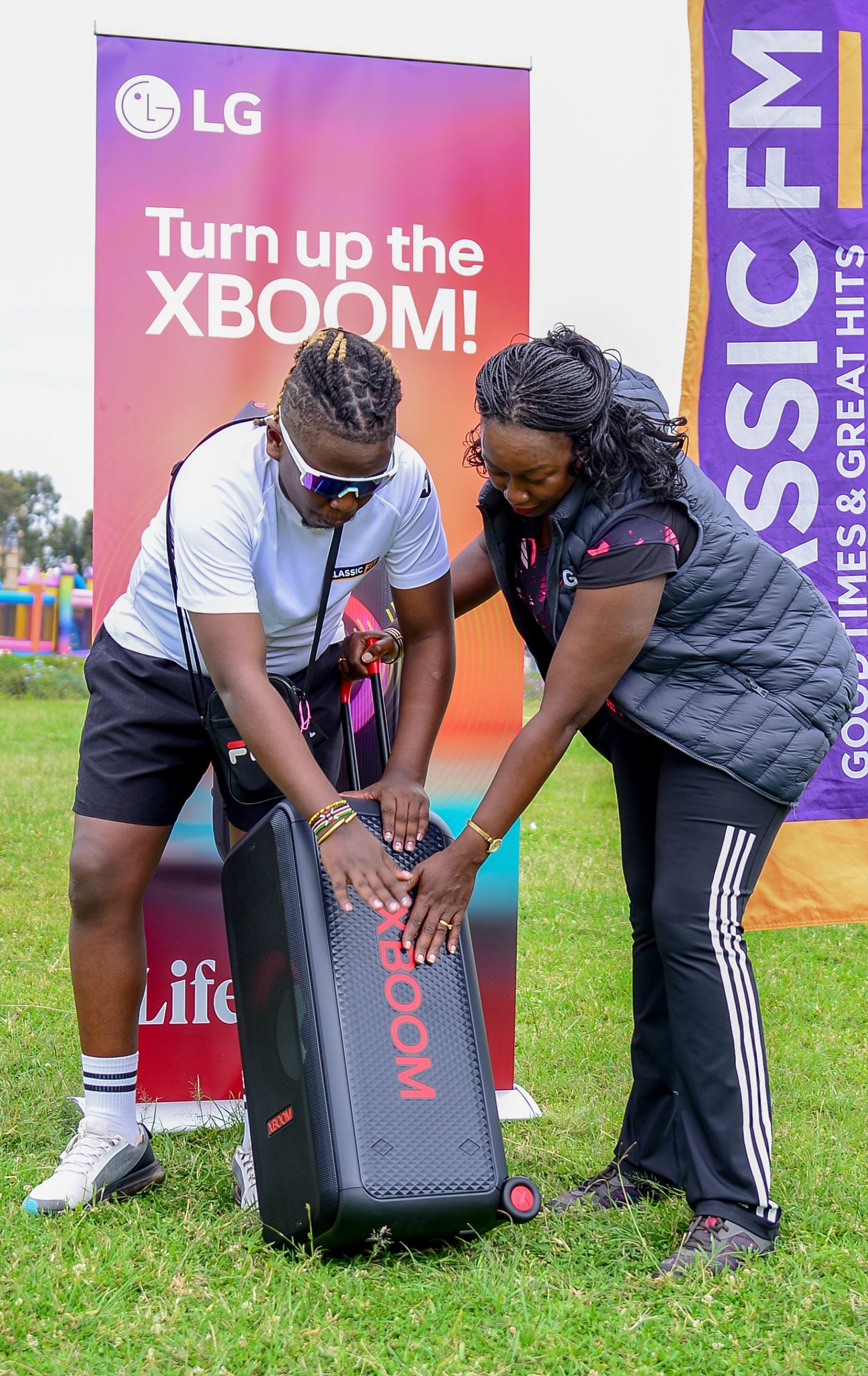 Jane Kariuki, Head of Marketing at LG Electronics East Africa (Right) and William Kamotho, Strategic Partnerships Lead at Radio Africa Group, pose with the LG XBOOM speaker during the Classic 105 Classic Fit event held at Waterfront Karen. LG XBOOM was the title sponsor for the Classic Fit event, powering the energy and experience with its premium sound.
